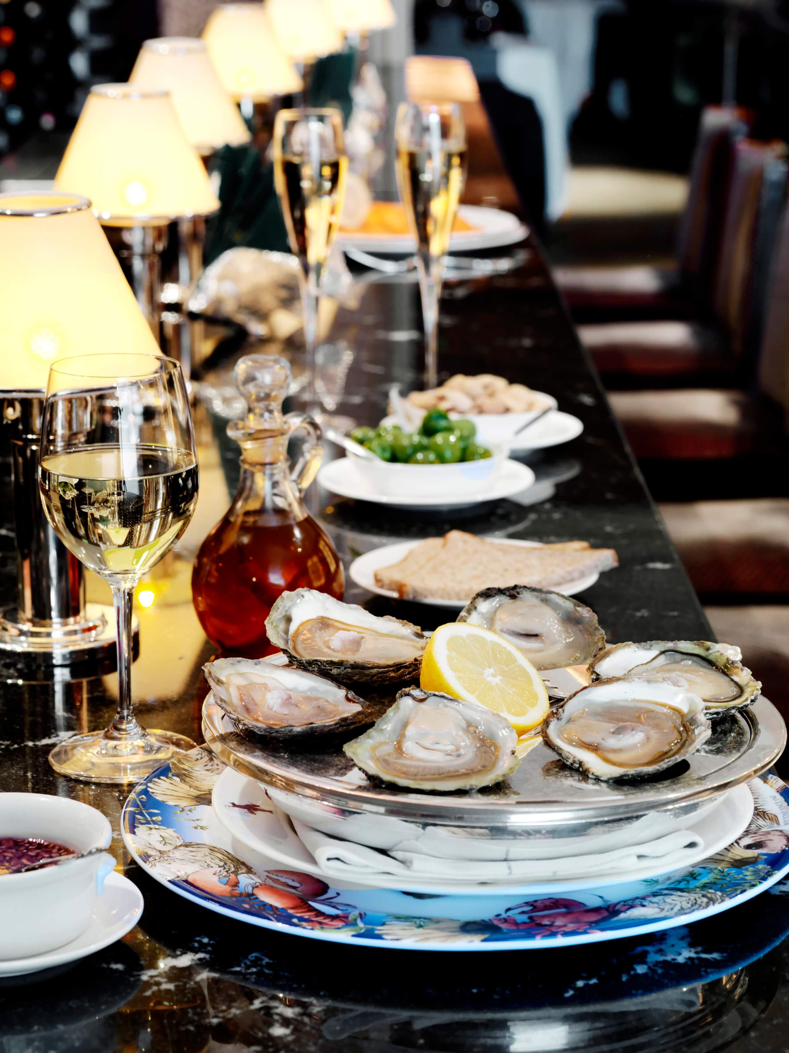 Wiltons - Oysters on bar evening, champagne cocktails, bars in london, best bars in london, champagne tasting london, champagne bars london, cocktail bars london,champagne bar london,  london nightlife, london bars, london cocktails