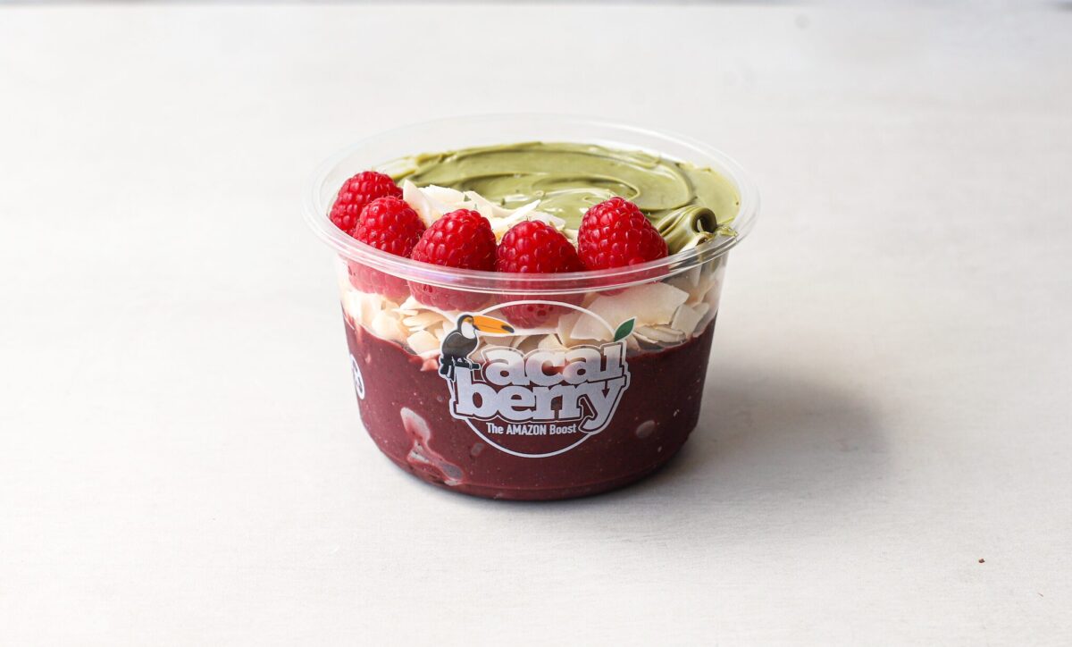 Pistachio Dream Acai Bowl topped with raspberries and coconut in London café